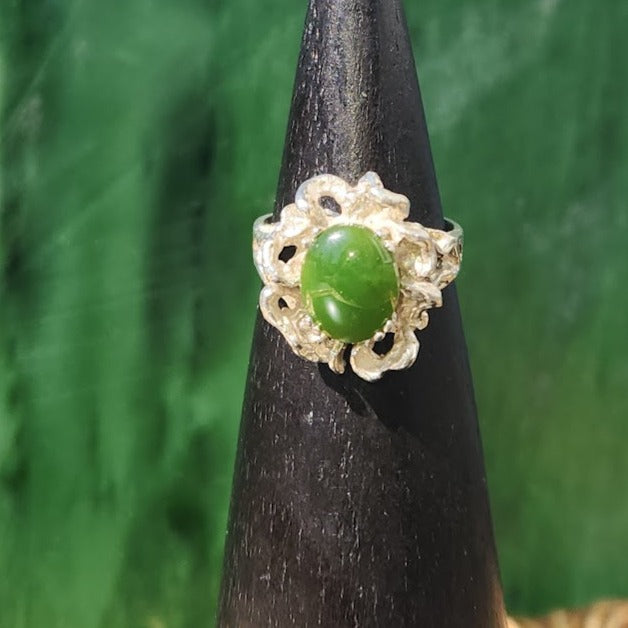 Vintage Jade Medusa ring with a green cabochon in an ornate silver setting
