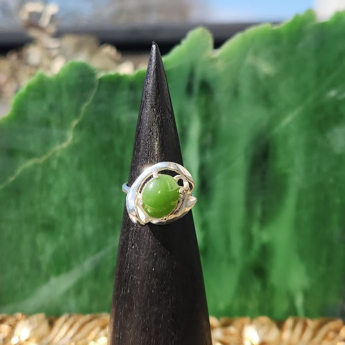 Silver Jade Ring front view on a black cone display showing the green jade cabochon.