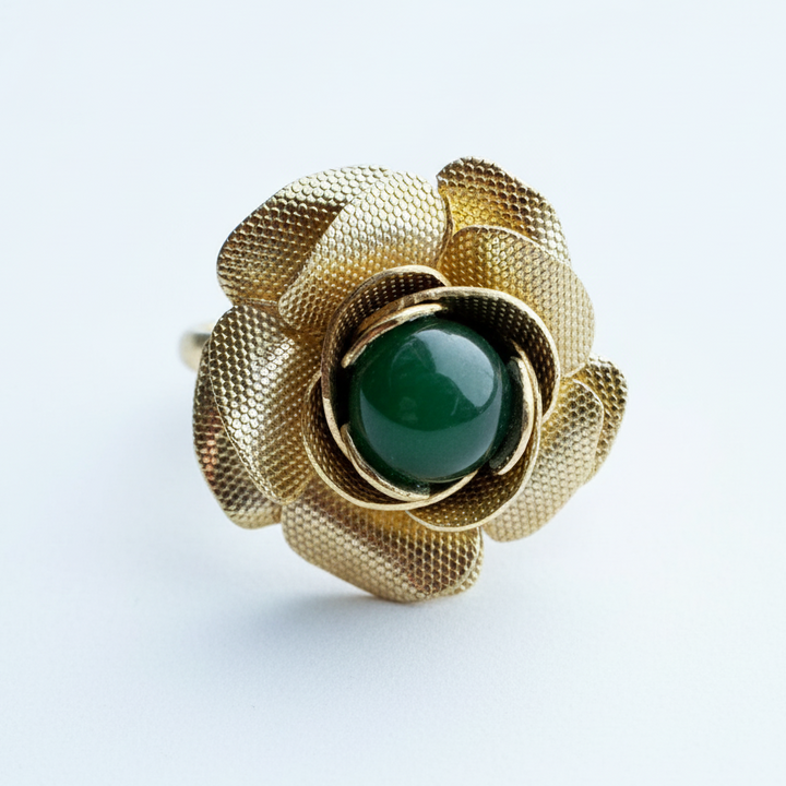 Vintage gold tone rose ring with textured petals and a green jade cabochon center.