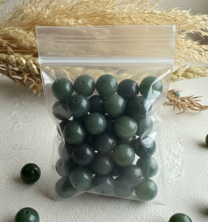 Clear bag of natural Canadian nephrite jade beads 7-8.5 mm mix