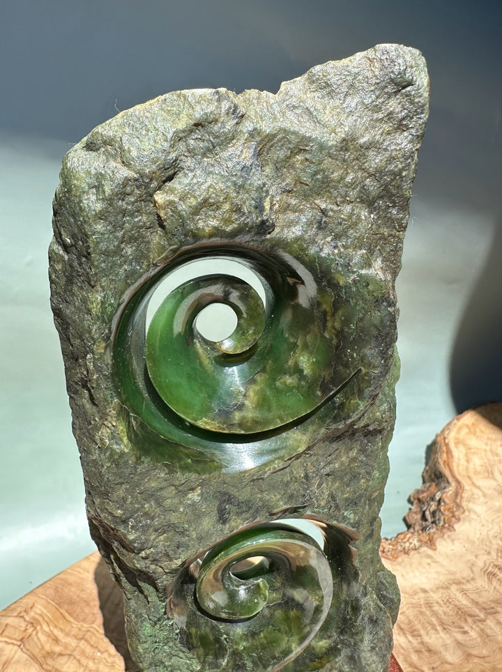 Canadian Jade Double Koru Sculpture set in rugged rock base with green spirals