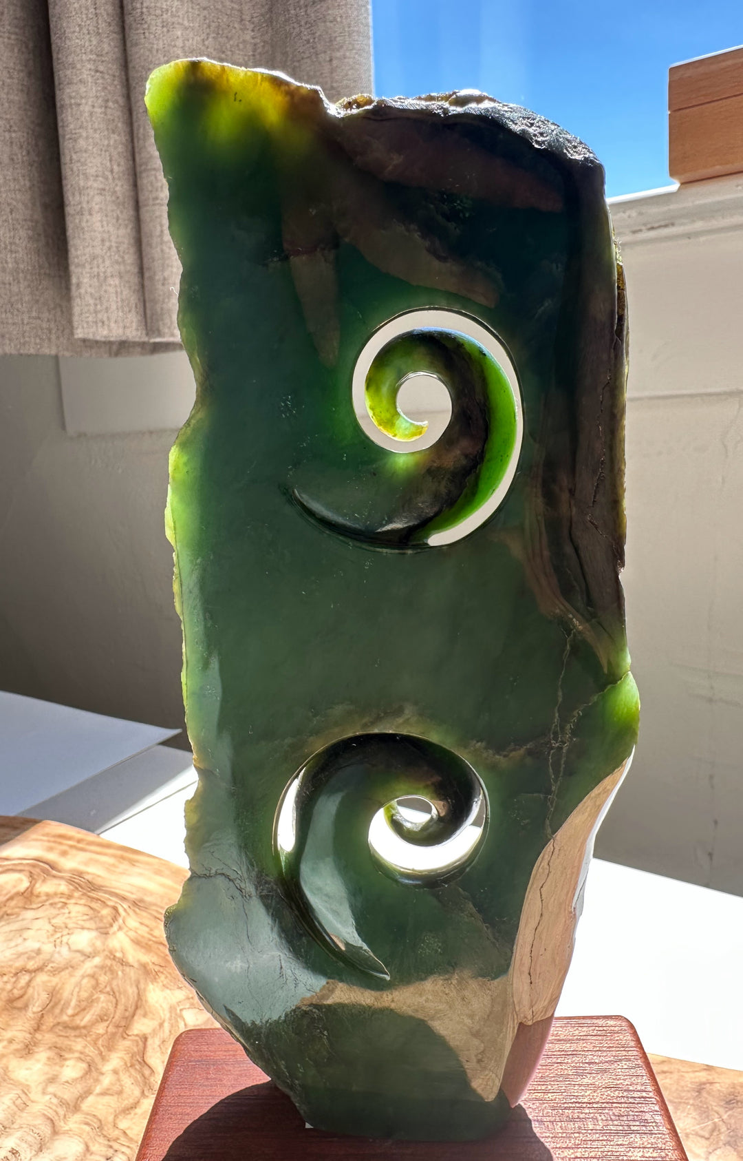 Canadian Jade Double Koru Sculpture 8 inches featuring two spiral koru cutouts in glossy green jade mounted on a wooden base