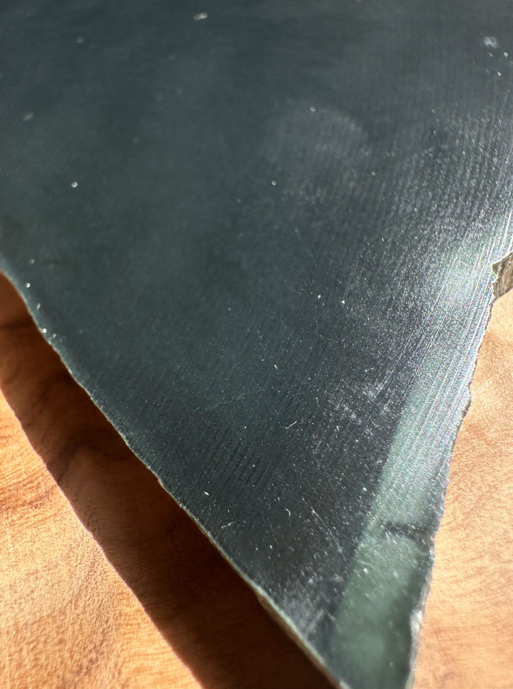 Close-up of jade on a wooden surface