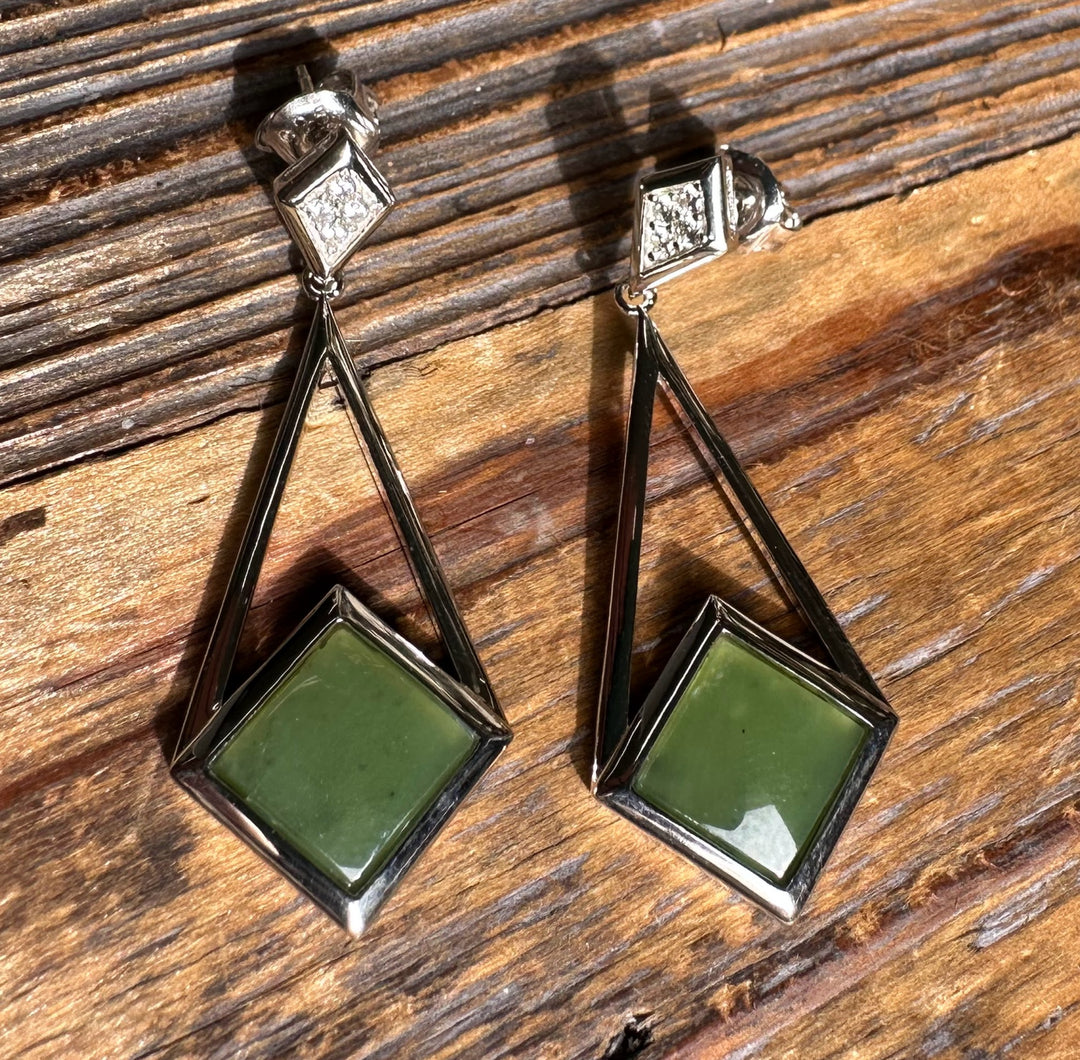 Canadian nephrite jade drop earrings featuring green square stones in geometric silver frames with diamond accents