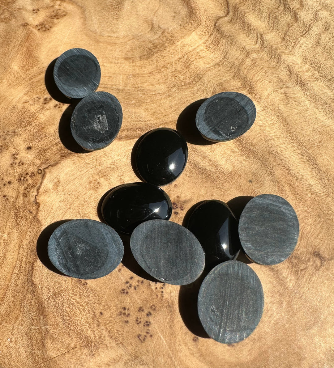 Black jade on a wooden surface