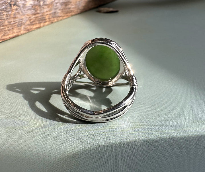 Canadian Jade Silver Ring featuring a large oval green jade stone set in a sculpted silver band