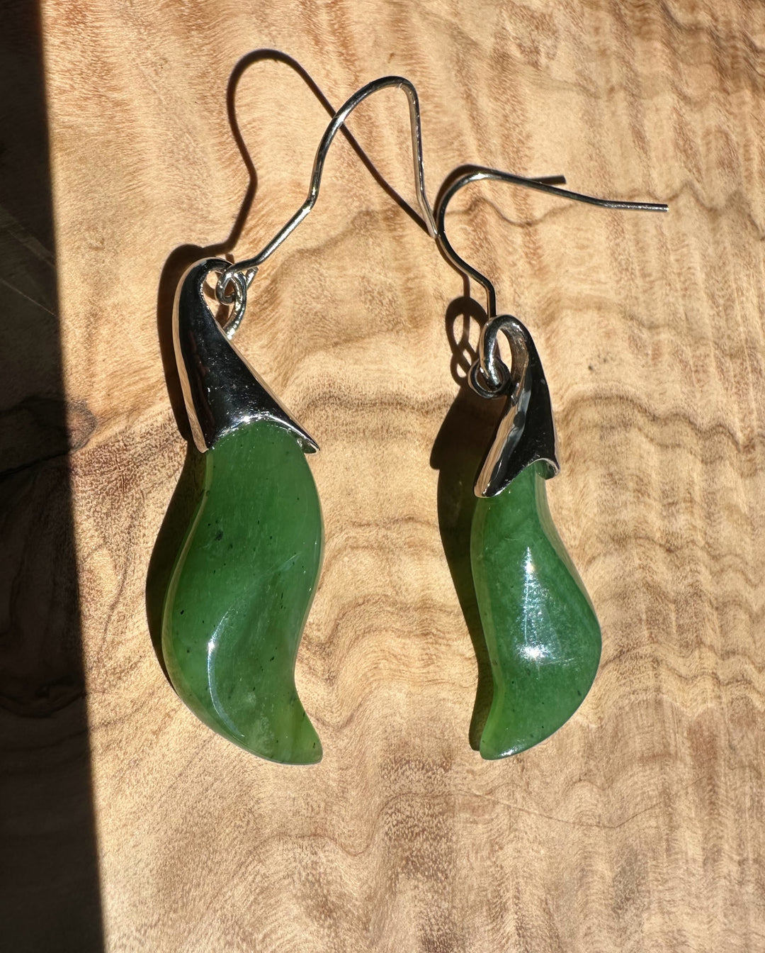 Nephrite jade earrings with green curved drops and stainless steel hooks
