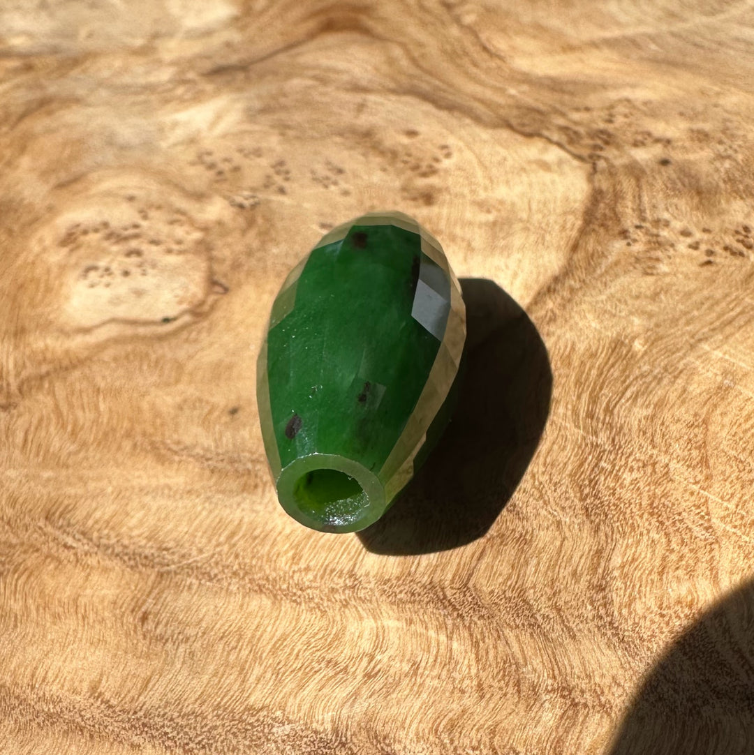 Green jade on a wooden surface