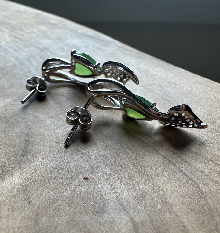 Silver leaf shaped earrings with green nephrite jade and zircon accents.