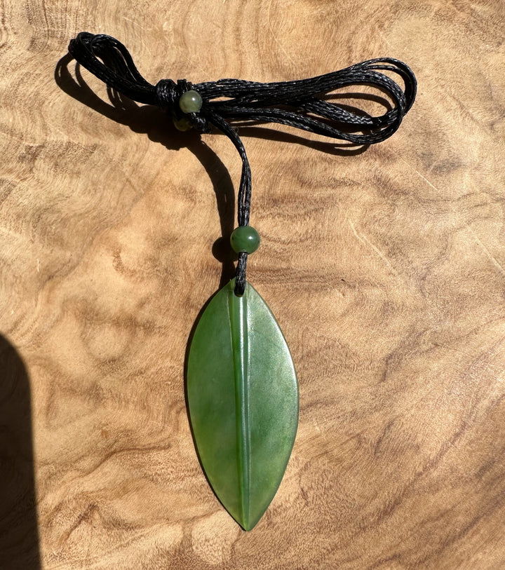 Siberian jade leaf pendant 42mm on a black cord with green bead accents