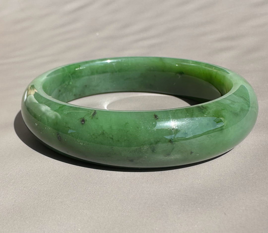 Canadian Jade Bangle 58 x 15mm dark green with natural color variations and polished surface