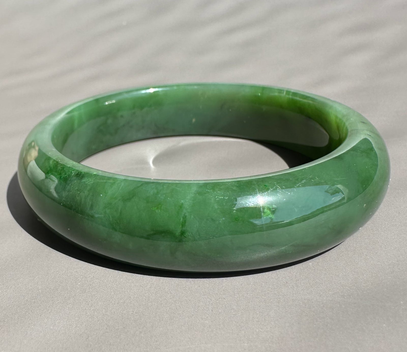 Canadian Jade Bangle 58 x 15mm green with a thick rounded edge and smooth finish