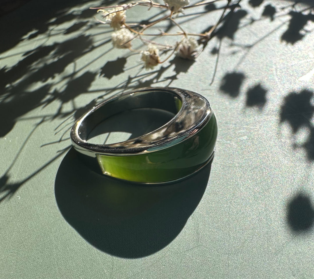 Canadian Jade Ring featuring a wide green nephrite jade centerpiece in a polished silver band