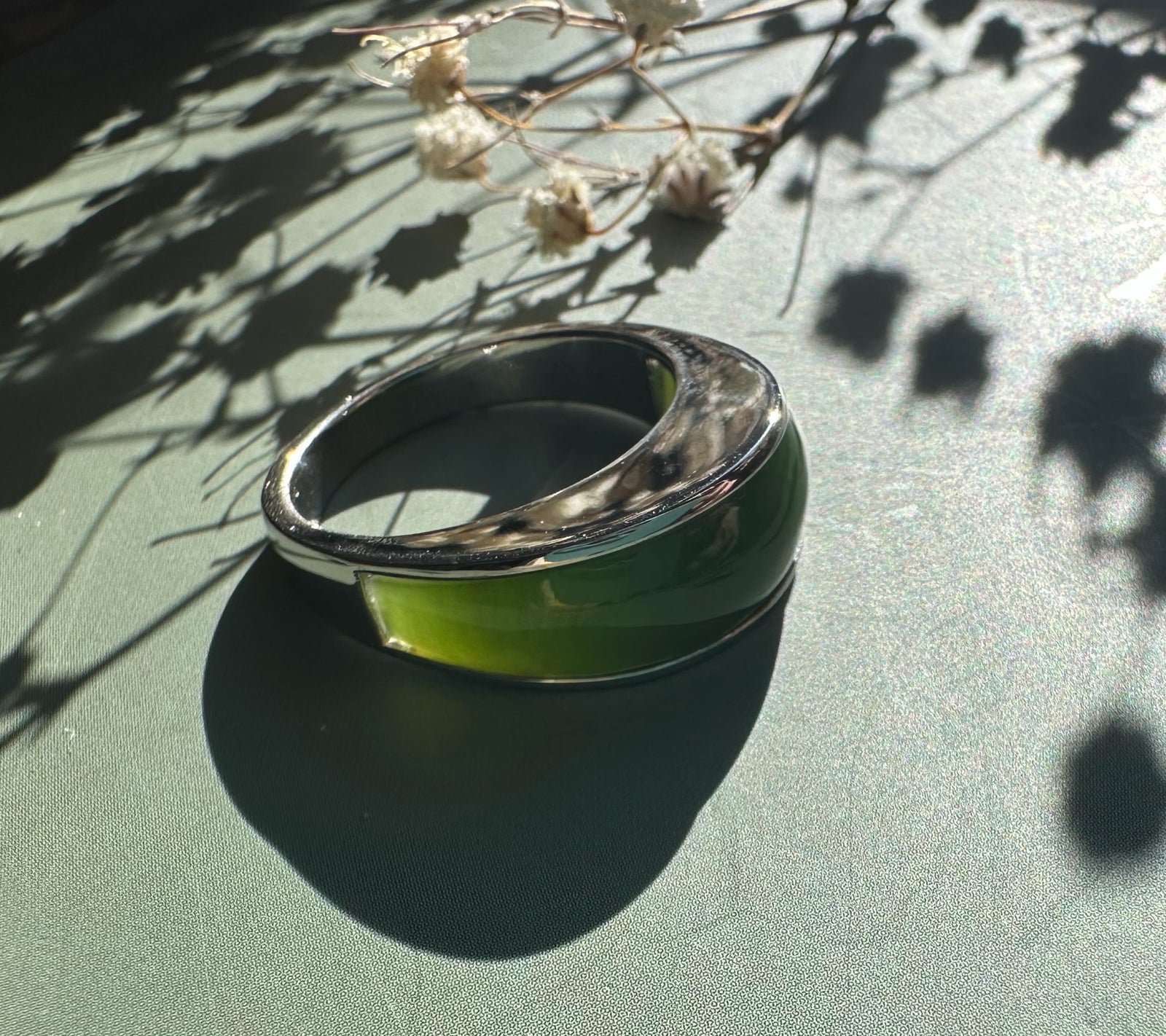 Canadian Jade Ring featuring a wide green nephrite jade centerpiece in a polished silver band