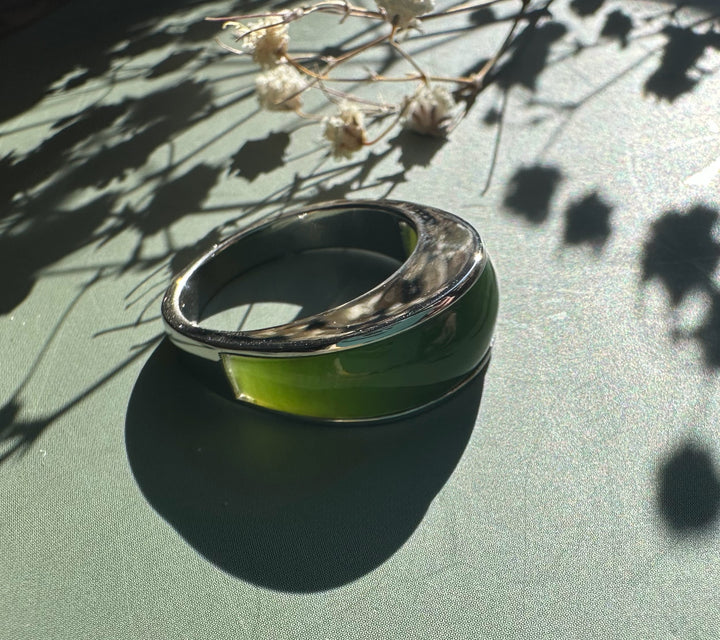 Canadian Jade Ring featuring a wide green nephrite jade centerpiece in a polished silver band