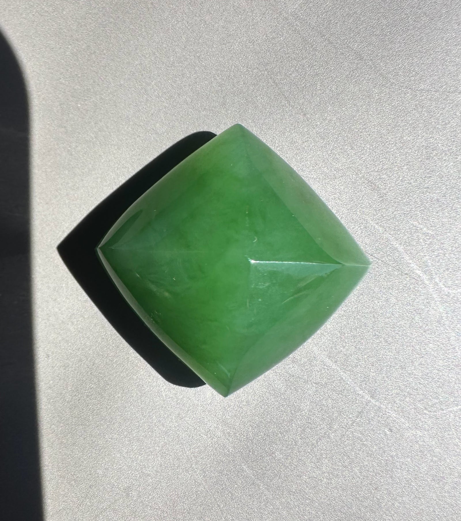 Green jade on a gray surface