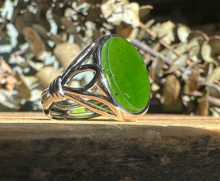 Canadian Jade Silver Ring featuring a large oval green jade in a silver setting