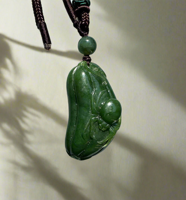 Canadian jade Spider and Gourd Pendant carved from green jade on a dark braided cord