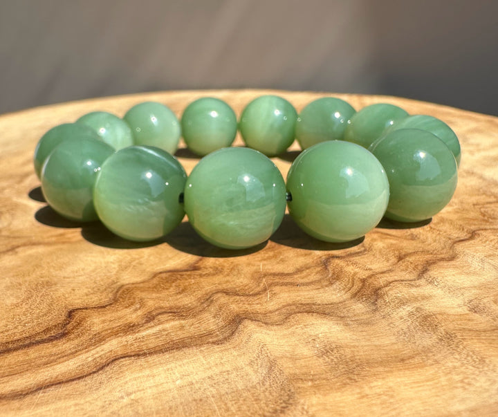 aa jade on wooden base