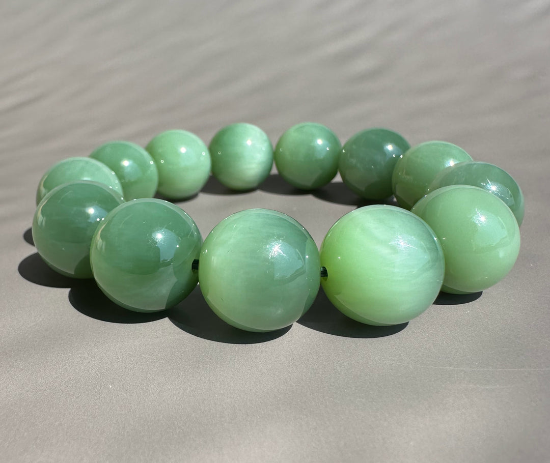green jade beads on grey base