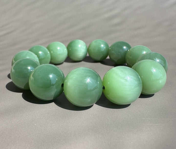 green jade beads on grey base