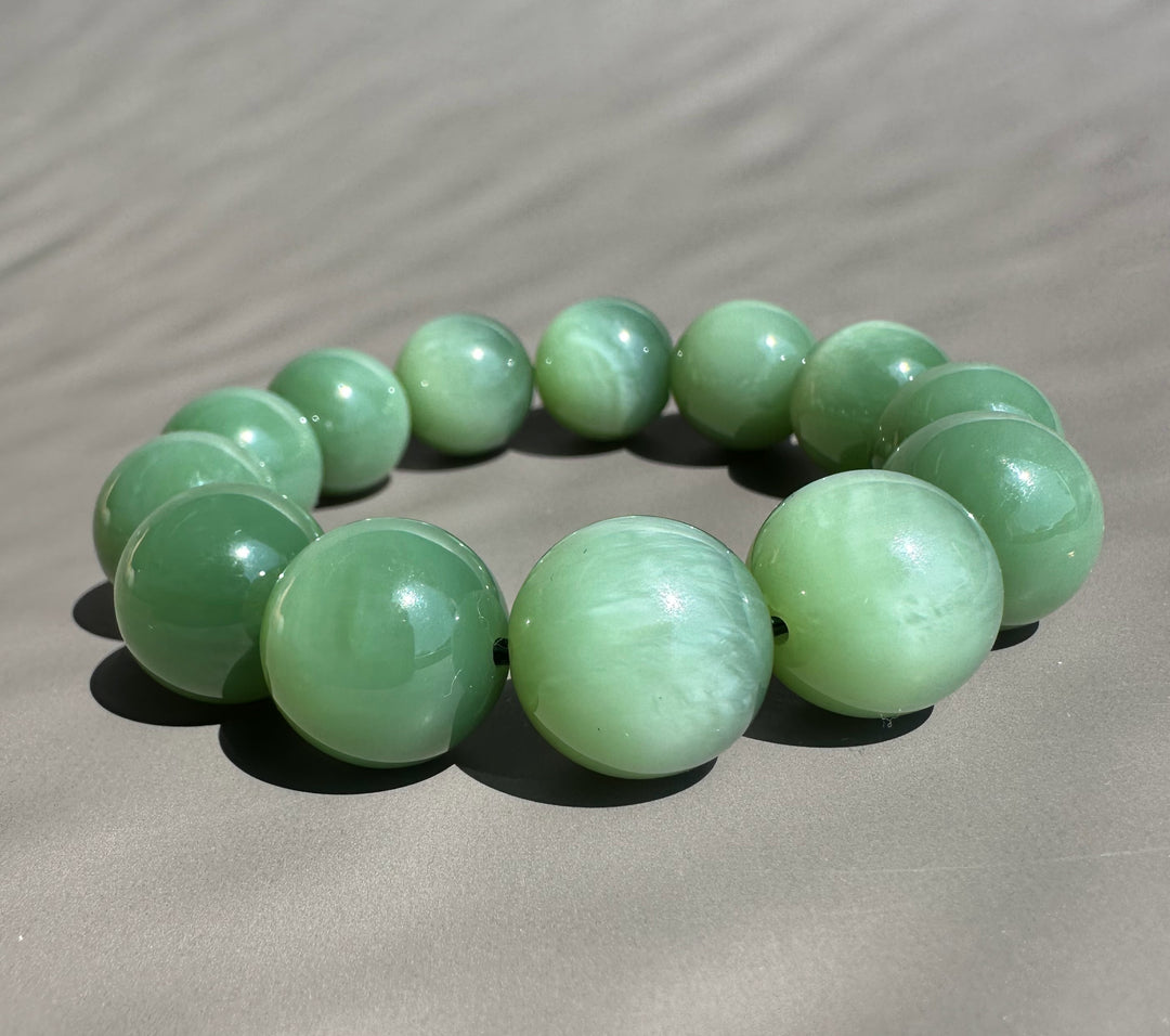 cats eye jade beads on grey base