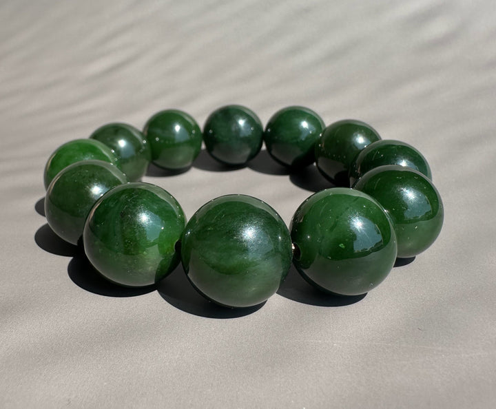 jade beads on grey background