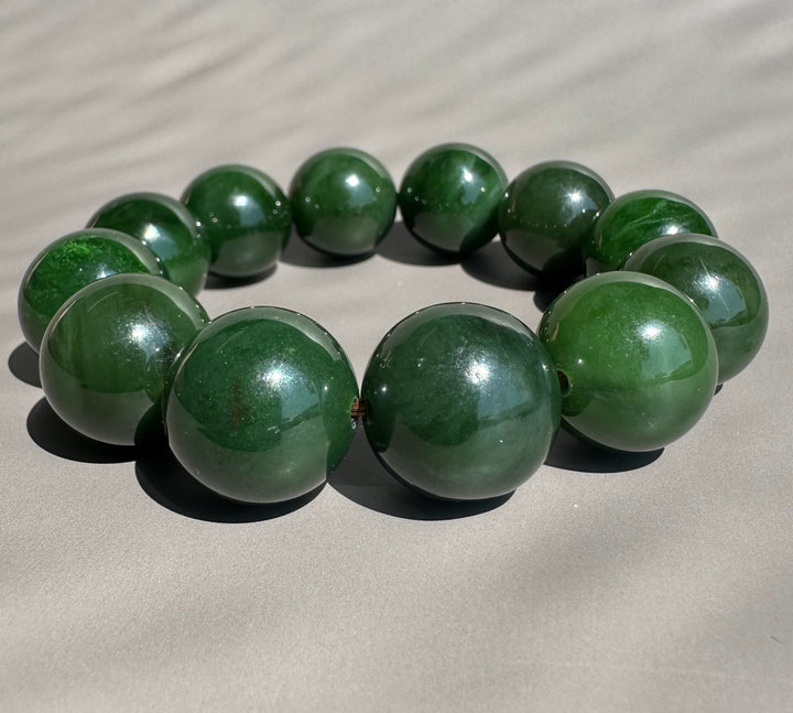 dark green jade on grey background