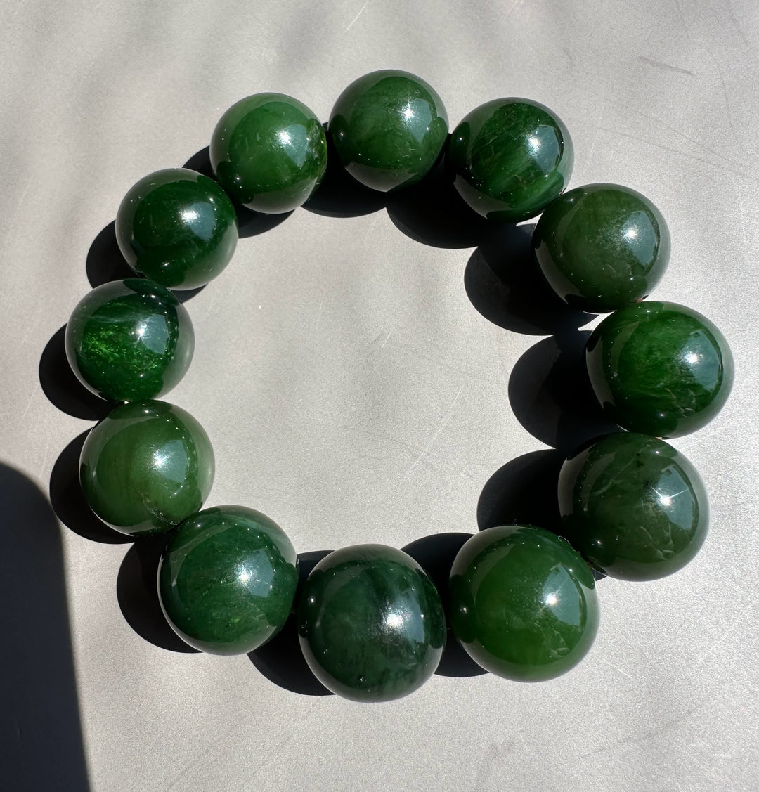 dark green jade on grey background