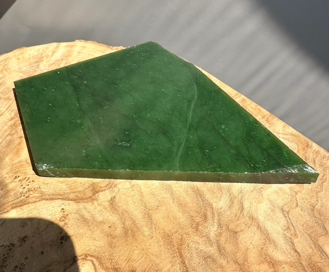 green jade on wood base
