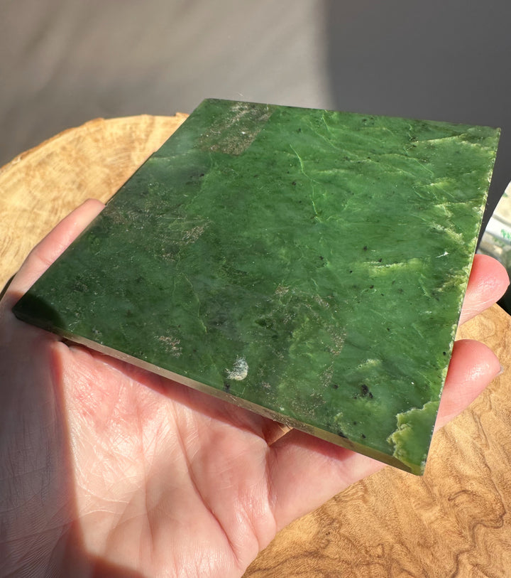 jade slab being held by someones hand