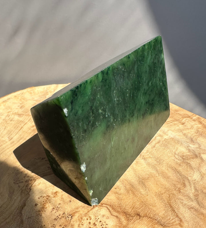 bottom side of jade ingot on wooden base