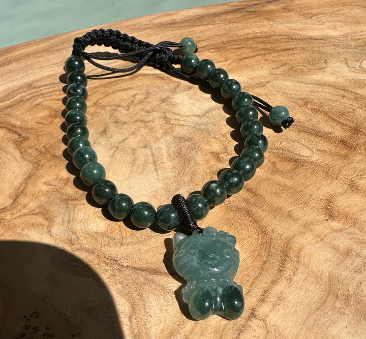 Guatemalan jadeite bead bracelet with adjustable black cord and a carved jade cat pendant