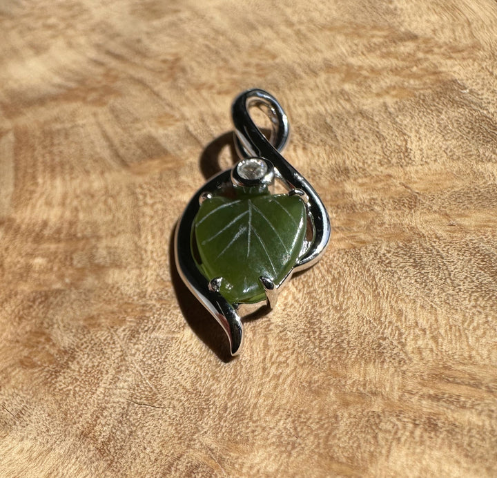 Canadian Jade Leaf and Silver Infinity Pendant with a green jade leaf and a silver infinity loop.