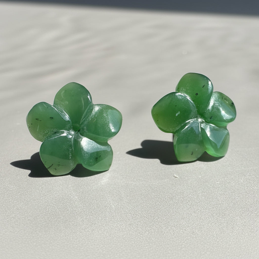 jade flower earrings on grey background