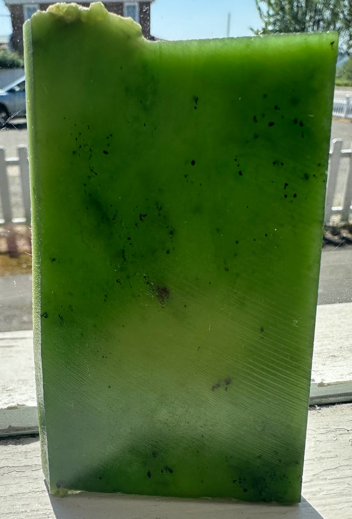 green jade slab on window sill