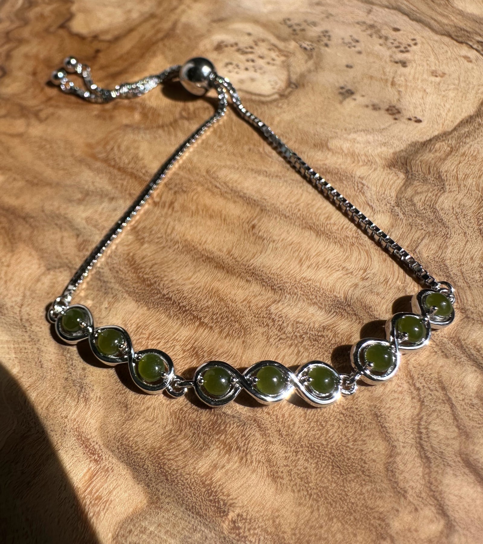 Sterling silver bracelet with round Canadian jade beads set in bezel links