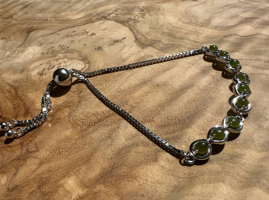 Close view of sterling silver bracelet with Canadian jade beads in bezel settings
