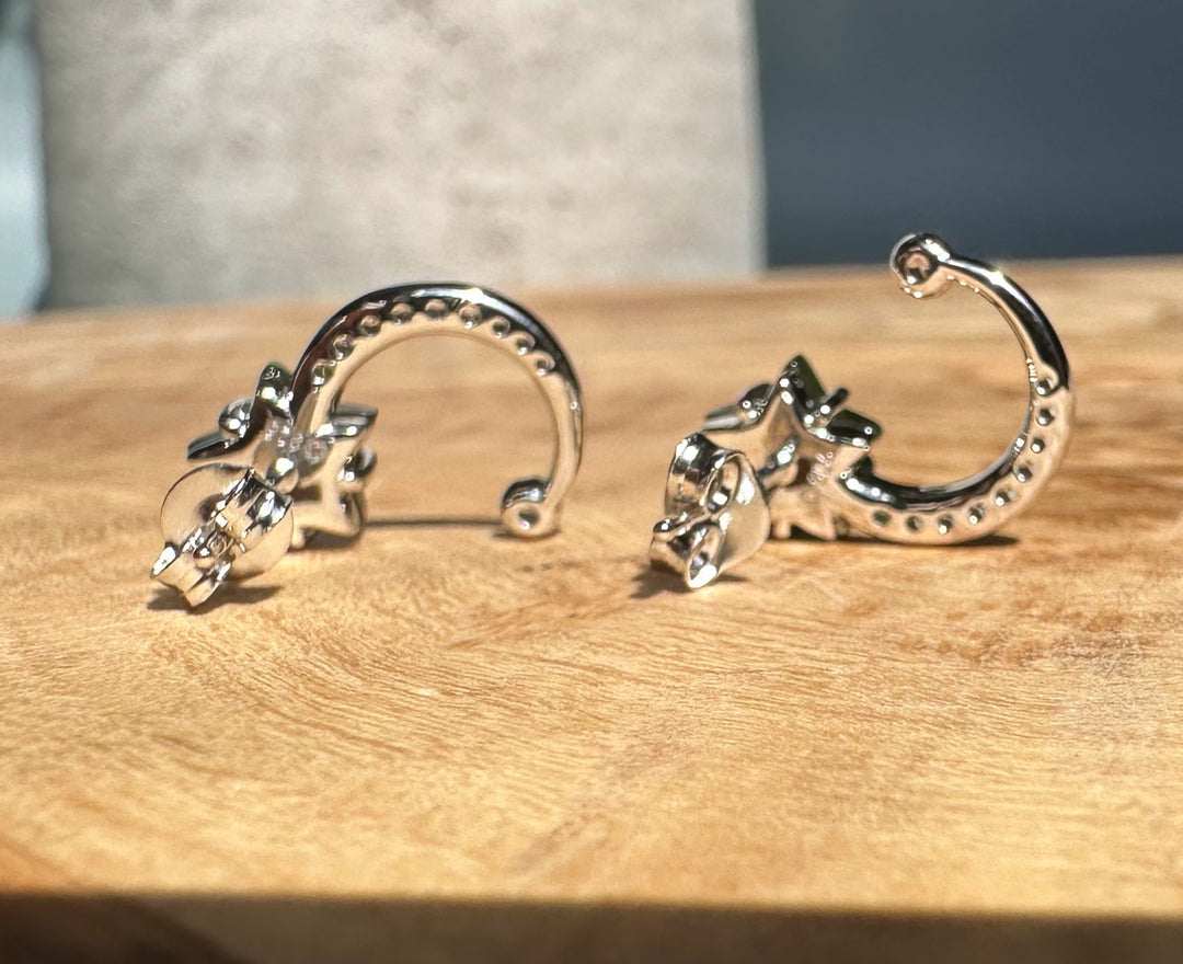Silver Star and Moon Studs front view with crystal encrusted crescents and green star accents