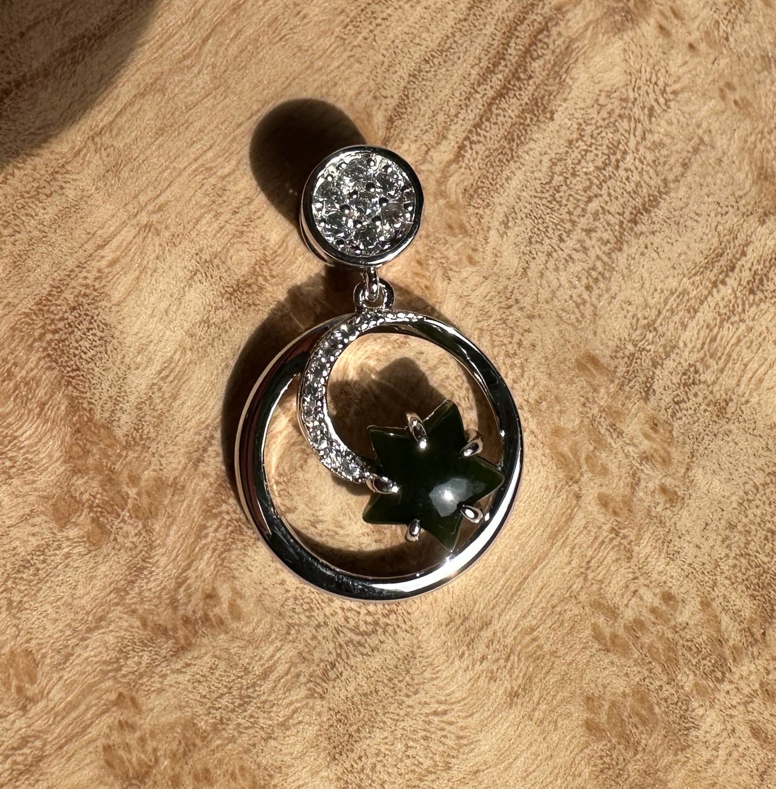 Canadian Jade and Silver Star and Moon Pendant featuring a crystal studded round cap a crystal crescent and a dark green jade star