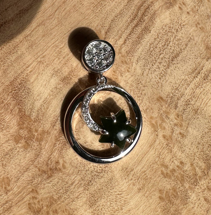 Canadian Jade and Silver Star and Moon Pendant featuring a crystal studded round cap a crystal crescent and a dark green jade star