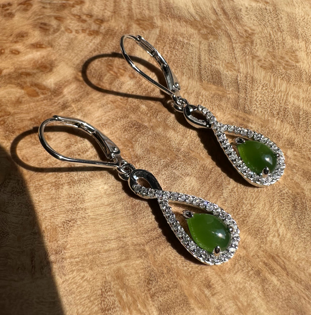 Pair of Canadian Jade and Silver Infinity Twist Earrings with green jade teardrops surrounded by pavé crystals on silver