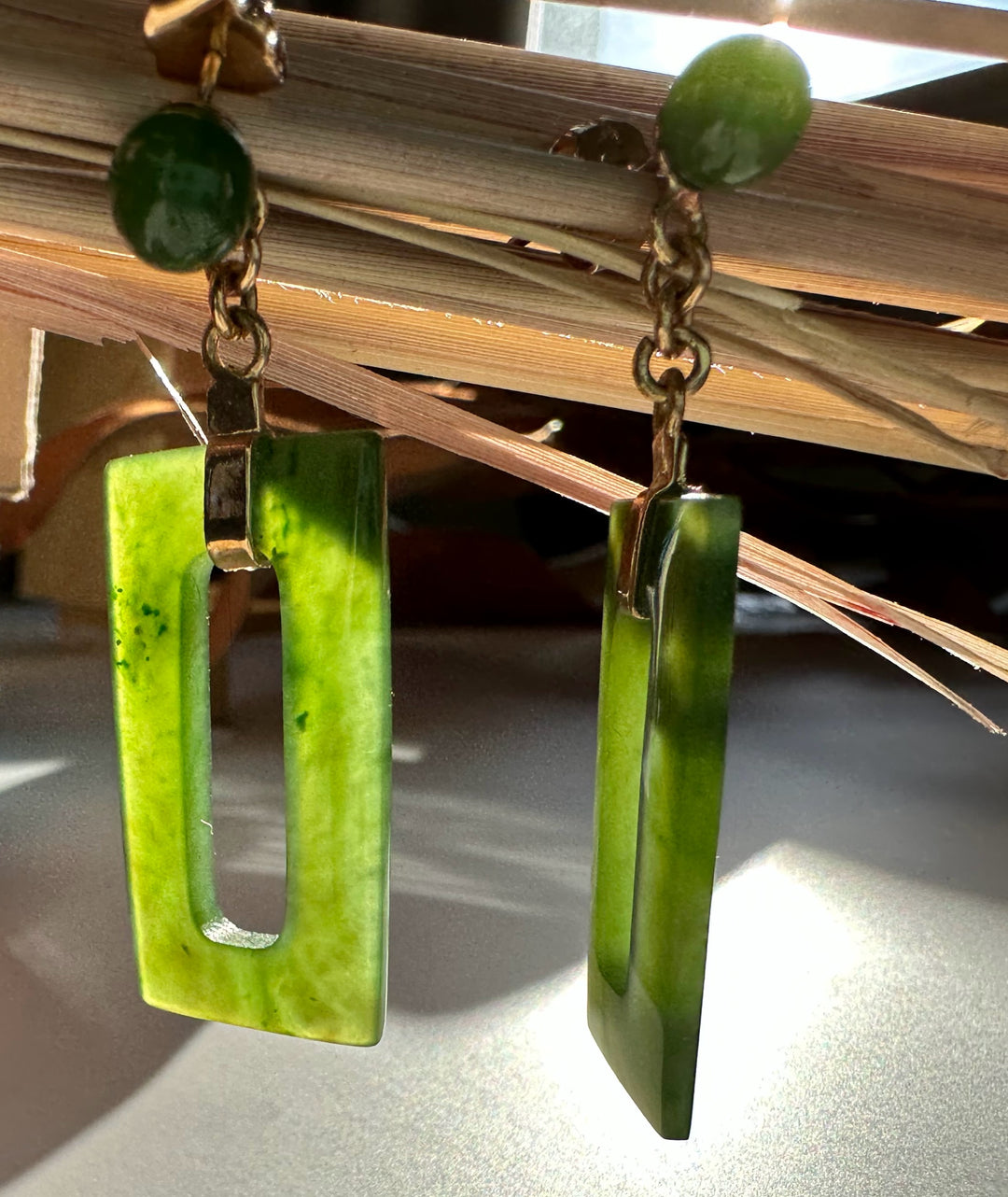 Vintage jade rectangle drop earrings with open center and small round jade beads at the top.