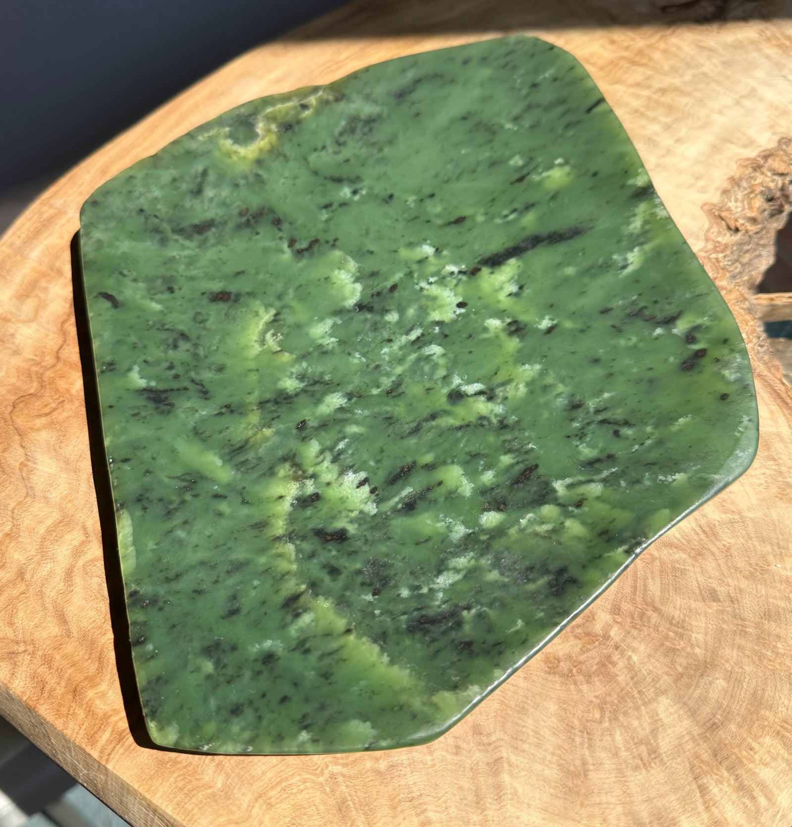 Green stone dish on a wooden surface