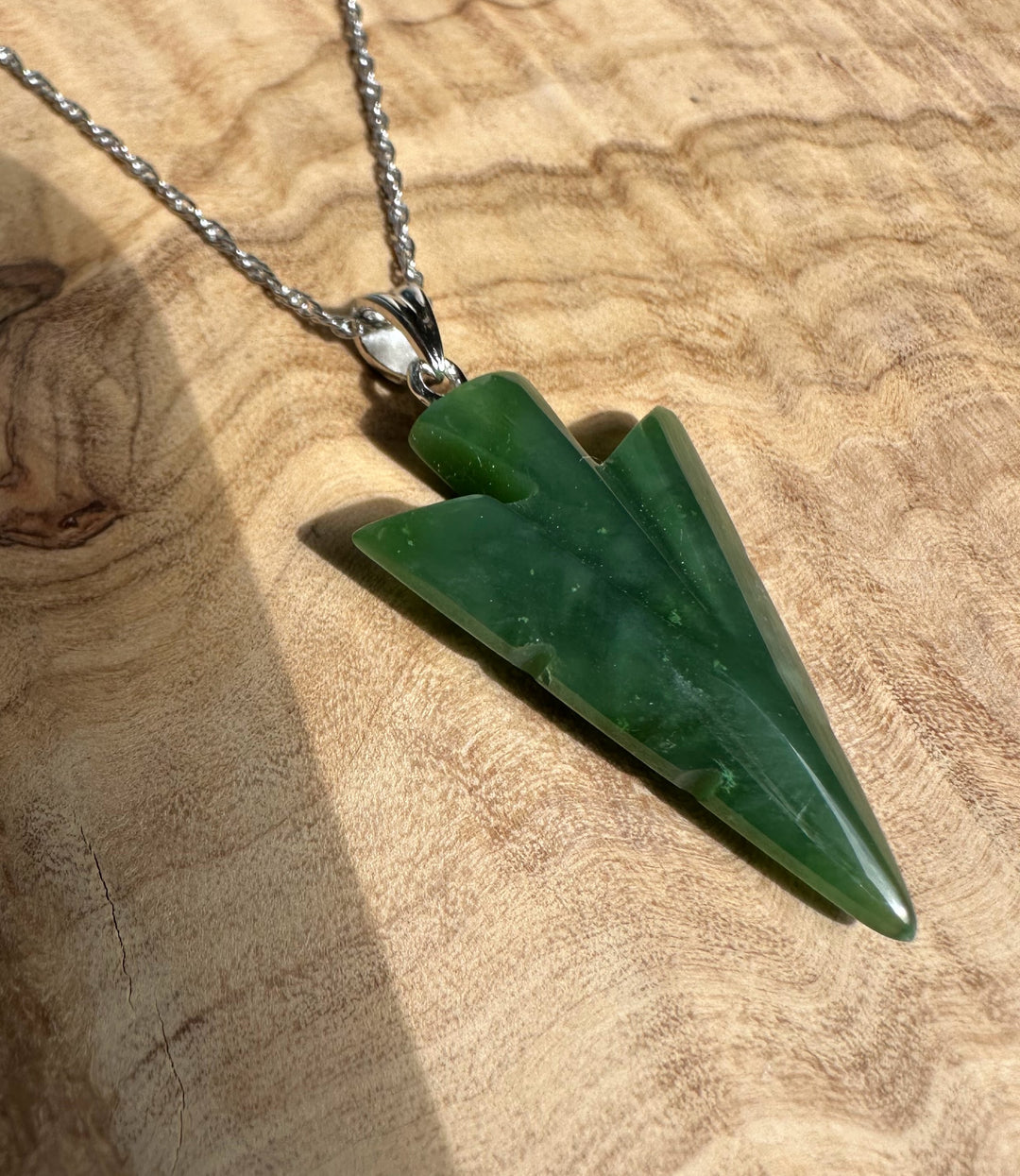 Canadian Jade Arrow Pendant 31mm hanging from a silver chain