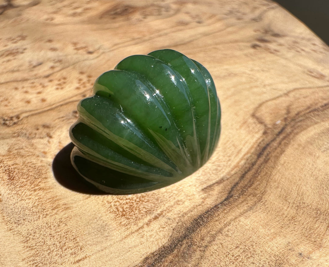Green jade on a wooden surface
