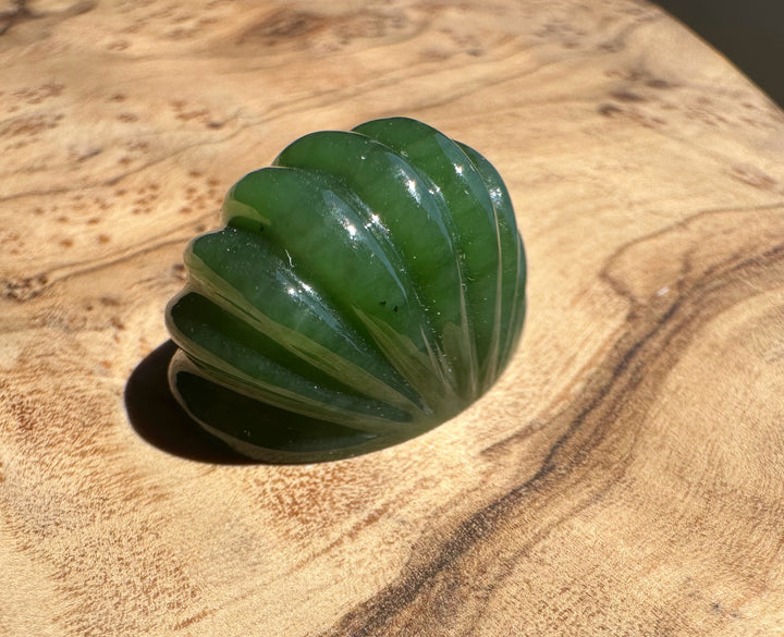 Green jade on a wooden surface