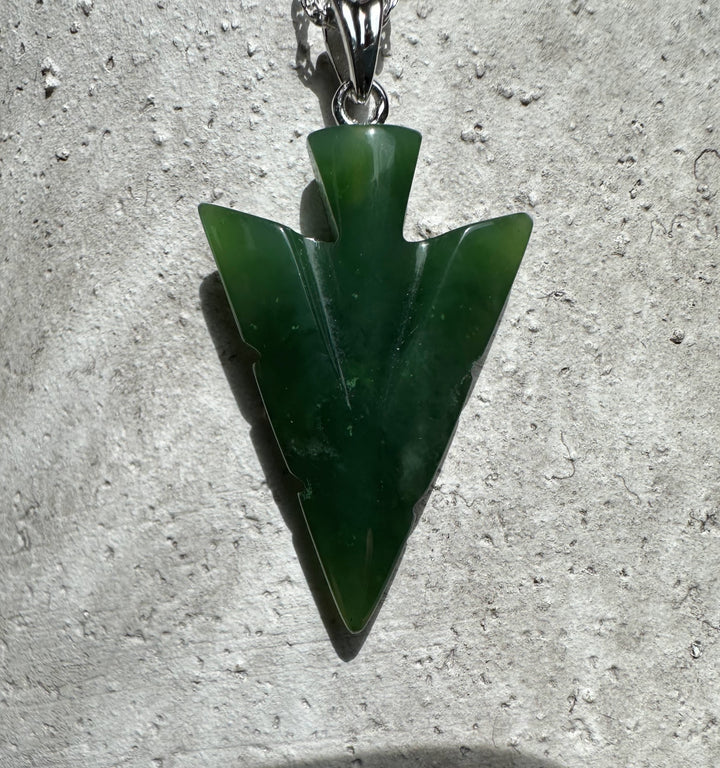 Canadian Jade Arrow Pendant in deep green with a silver bail on a necklace