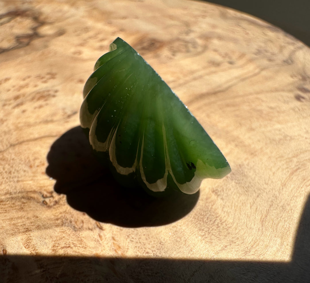 Green jade on a wooden surface