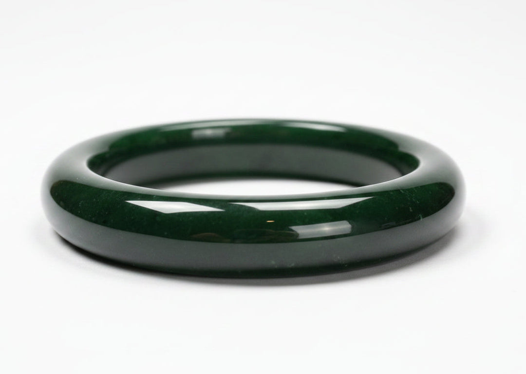 Green jade bangle on a white background 